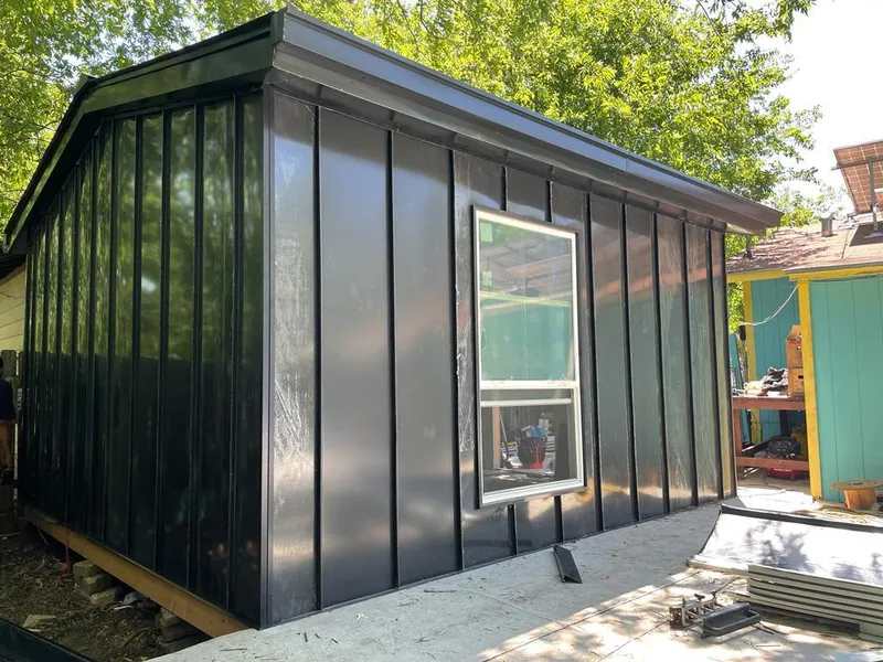 Black standing seam metal wall panels for Roof Inspection in New Braunfels