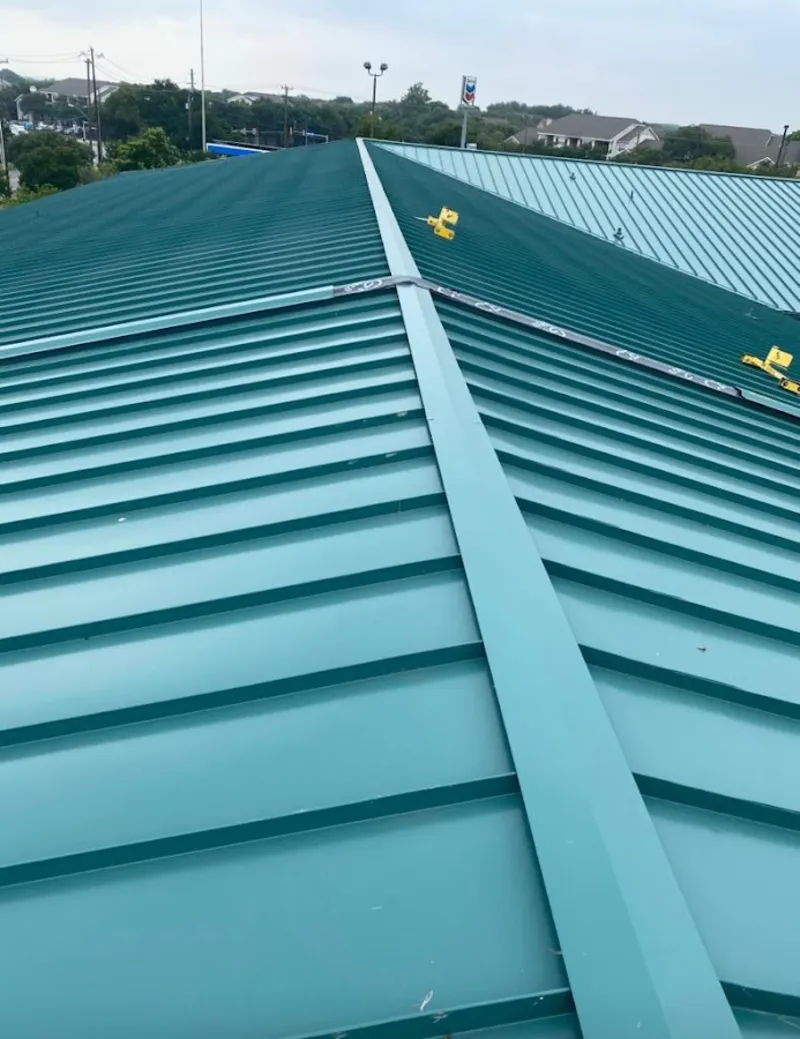 Green commercial metal roof ridge and valley for Metal Roof Repair in New Braunfels